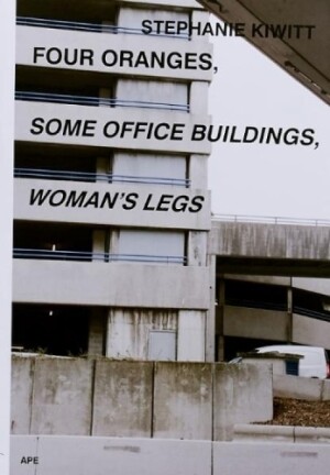 Four Oranges, Some Office Buildings, Woman’s Legs